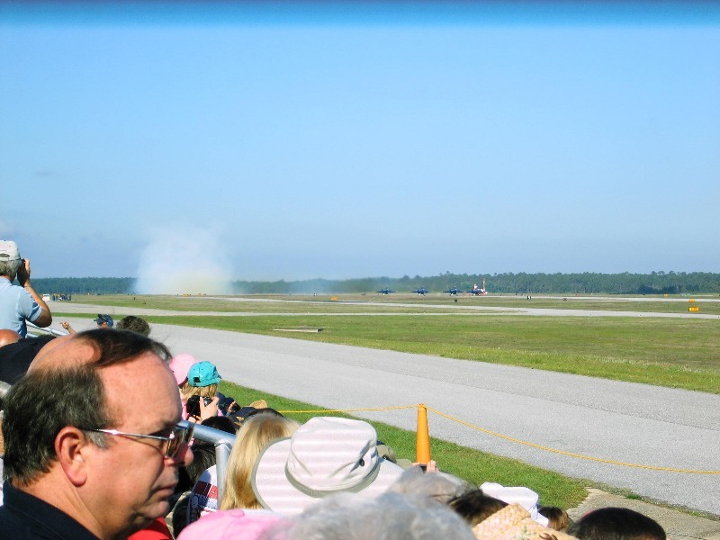 Just as the Number 5 and 6 planes lift off, they hit the smoke button.