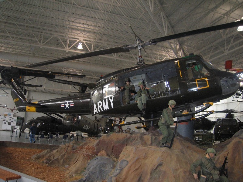 The UH-1D was referred to as a Slick because it didn't have the machine gun mounts of the UH-1B gunship. This scenario was a typical LZ (Landing Zone) drop off of troops. 