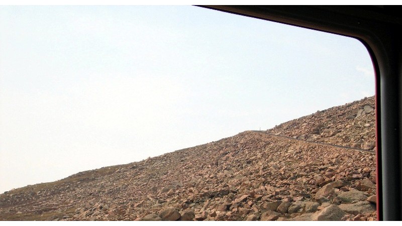 Here we are above the tree line, the point on the mountain where trees no longer grow because of the perma-frost, soil that remains below freezing, inhibiting growth. 