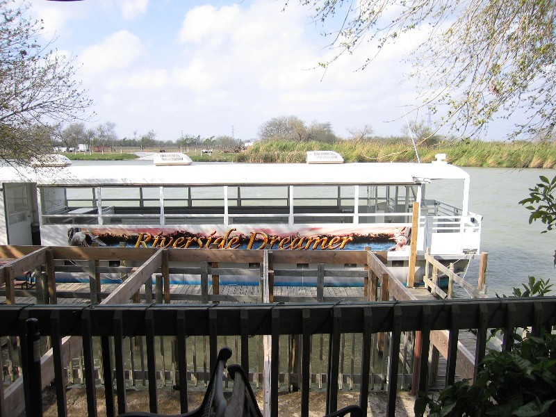 The Riverside Dreamer, enclosed pontoon boat.