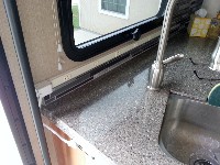 Kitchen Power Strip plugged in cabinet receptacle